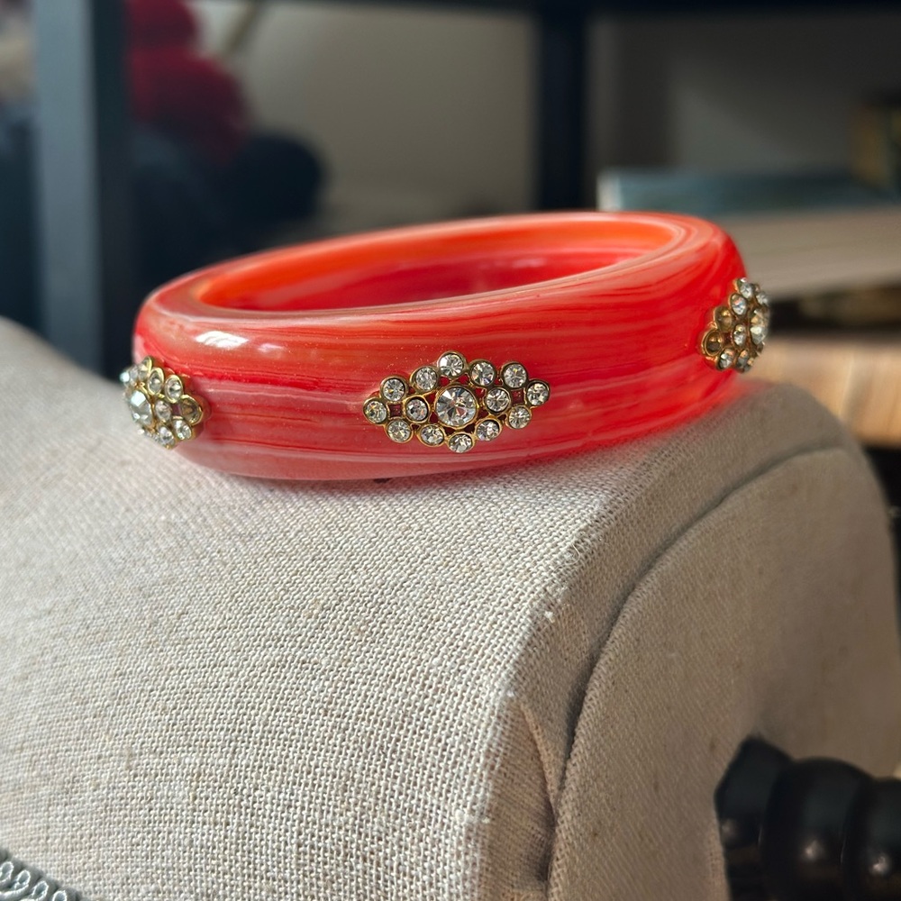 Juicy Couture pink lucite bangle with crystal detail.   5 crystals are missing